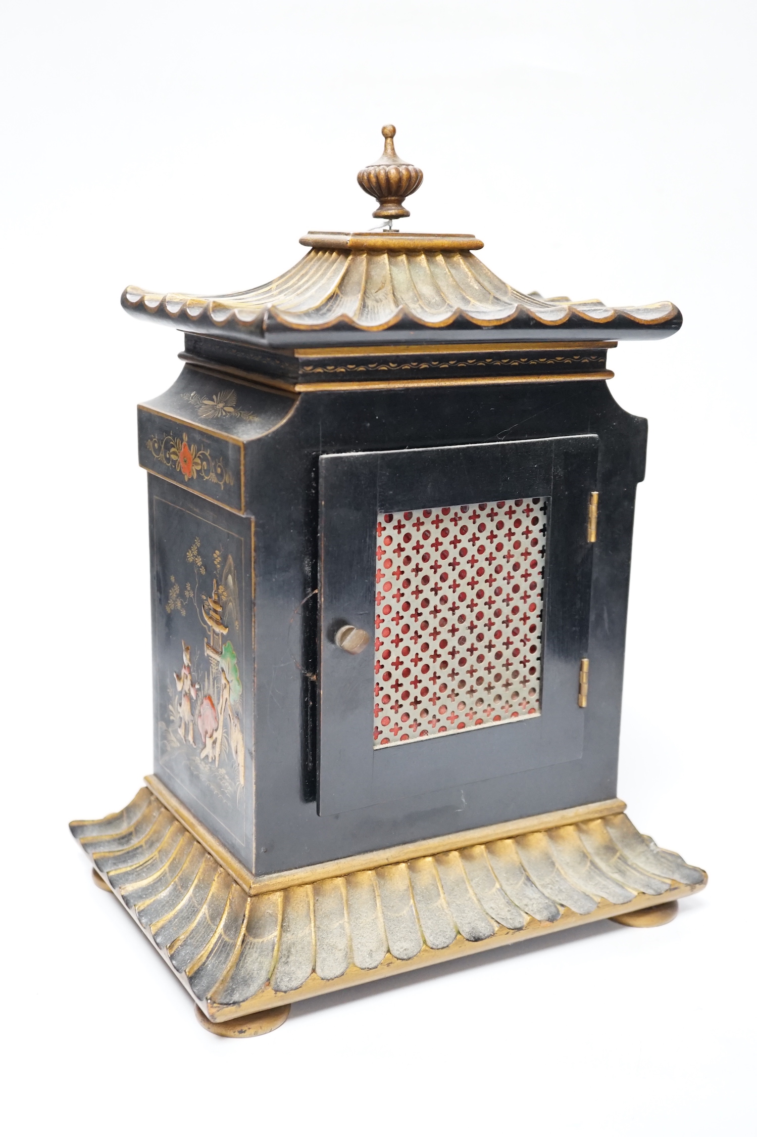 A George V chinoiserie lacquered mantel clock, decorated in relief with figures and pagodas, dial inscribed Birch & Gaydon, 31cm high